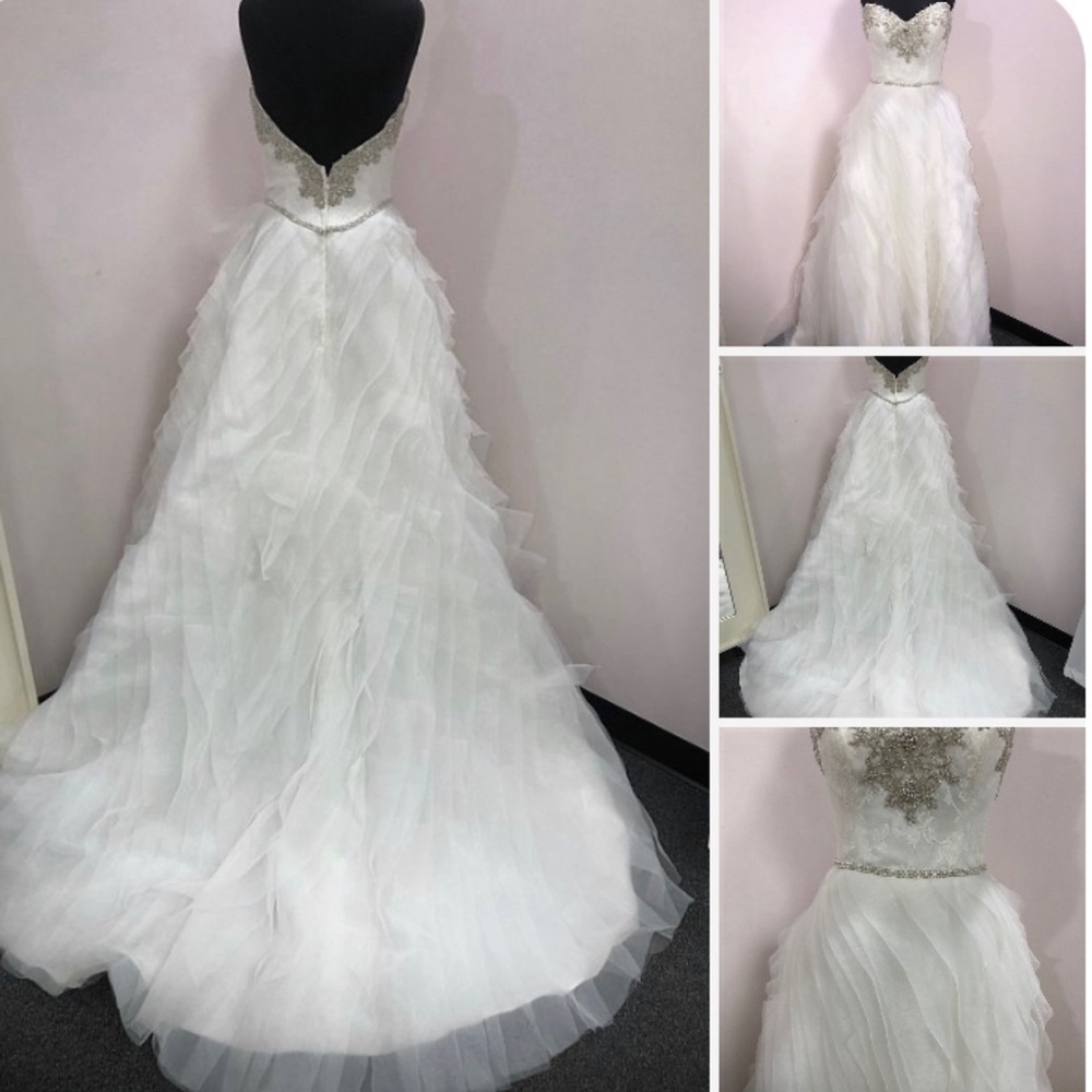Selling a custom made Winnie Couture wedding dress.